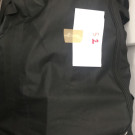 Varias bolsas y maletas con ropa seminueva